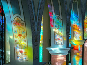 Light through coloured church stained glass windows